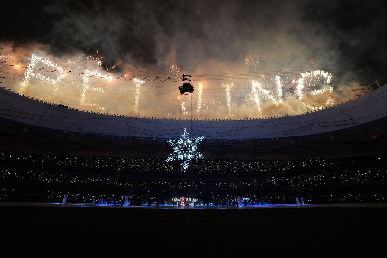 Fireworks ignite during the closing ceremony at the 2022 Winter Paralympics, Sunday, March 13, 2022...