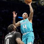 Ball scores 33 points, Hornets spoil Irving's home debut