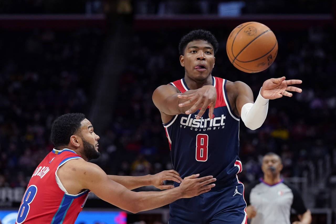 Washington Wizards forward Rui Hachimura (8) passes as Detroit Pistons guard Cory Joseph defends du...