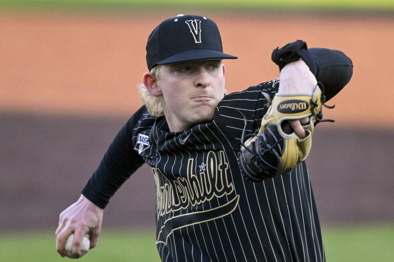 FILE - Vanderbilt pitcher Chris McElvain, wearing an electronic signal receiver on his left wrist, ...