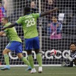 
              United States' Seattle Sounders forward Jordan Morris, left, and teammate defender Yeimar Gómez (28) celebrate a goal scored by teammate forward Raul Ruidiaz as Mexico's Pumas goalkeeper Alfredo Talavera looks on, right, during the first half of the second leg of the CONCACAF Champions League soccer final Wednesday, May 4, 2022, in Seattle. (AP Photo/Ted S. Warren)
            