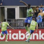 
              United States' Seattle Sounders defender Yeimar Gómez (28) celebrates a goal from teammate forward Raul Ruidiaz (9) during the first half of the second leg of the CONCACAF Champions League soccer final against Mexico's Pumas, Wednesday, May 4, 2022, in Seattle. (AP Photo/Ted S. Warren)
            