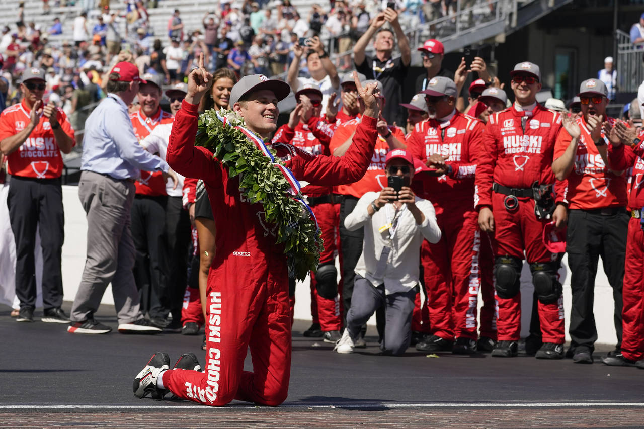 Marcus Ericsson, of Sweden, celebrates after winning the Indianapolis 500 auto race at Indianapolis...