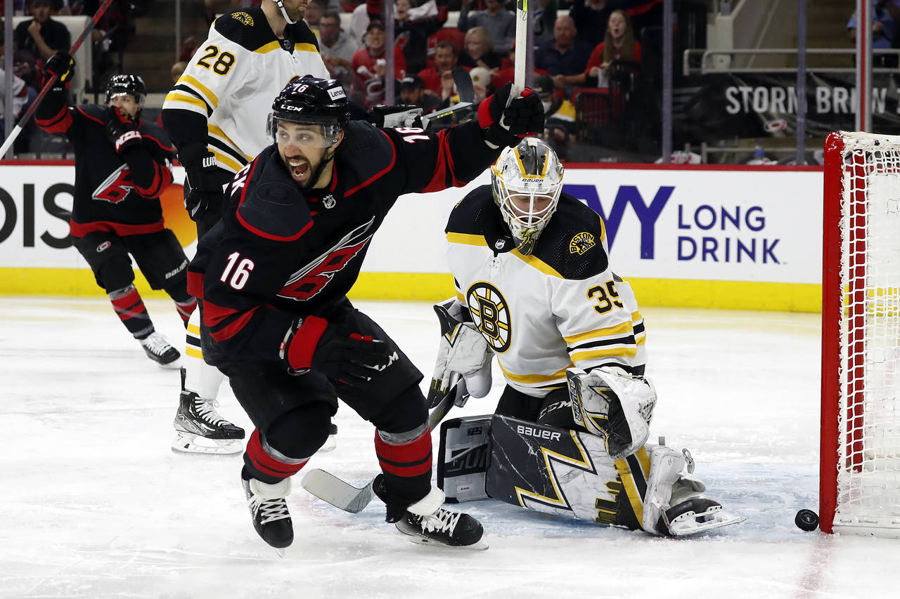 Carolina Hurricanes' Vincent Trocheck (16) celebrates a goal by  Sebastian Aho, not seen, on Boston...