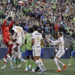 
              United States' Seattle Sounders goalkeeper Stefan Frei, left, leaps for the ball after a corner kick during the first half of the second leg of the CONCACAF Champions League soccer final against Mexico's Pumas, Wednesday, May 4, 2022, in Seattle. (AP Photo/Ted S. Warren)
            