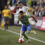 
              United States' Seattle Sounders forward Raul Ruidiaz (9) battles for the ball with Mexico's Pumas midfielder Favio Alvarez during the second half of the second leg of the CONCACAF Champions League soccer final Wednesday, May 4, 2022, in Seattle. (AP Photo/Ted S. Warren)
            