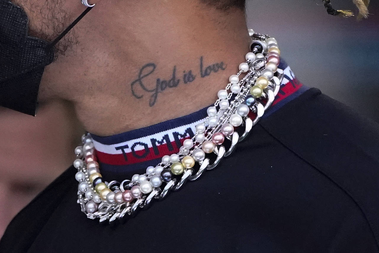 Mercedes driver Lewis Hamilton of Britain arrives for the first practice session for the Formula On...