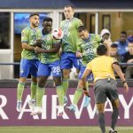 
              United States' Seattle Sounders defender Yeimar Gómez (28) and forward Jordan Morris (13) block a free kick against Mexico's Pumas during the second half of the second leg of the CONCACAF Champions League soccer final Wednesday, May 4, 2022, in Seattle. (AP Photo/Ted S. Warren)
            