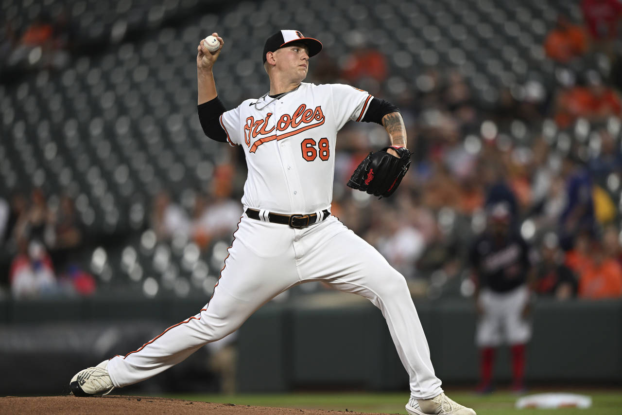 Baltimore Orioles pitcher Tyler Wells throws to a Washington Nationals batter during the first inni...