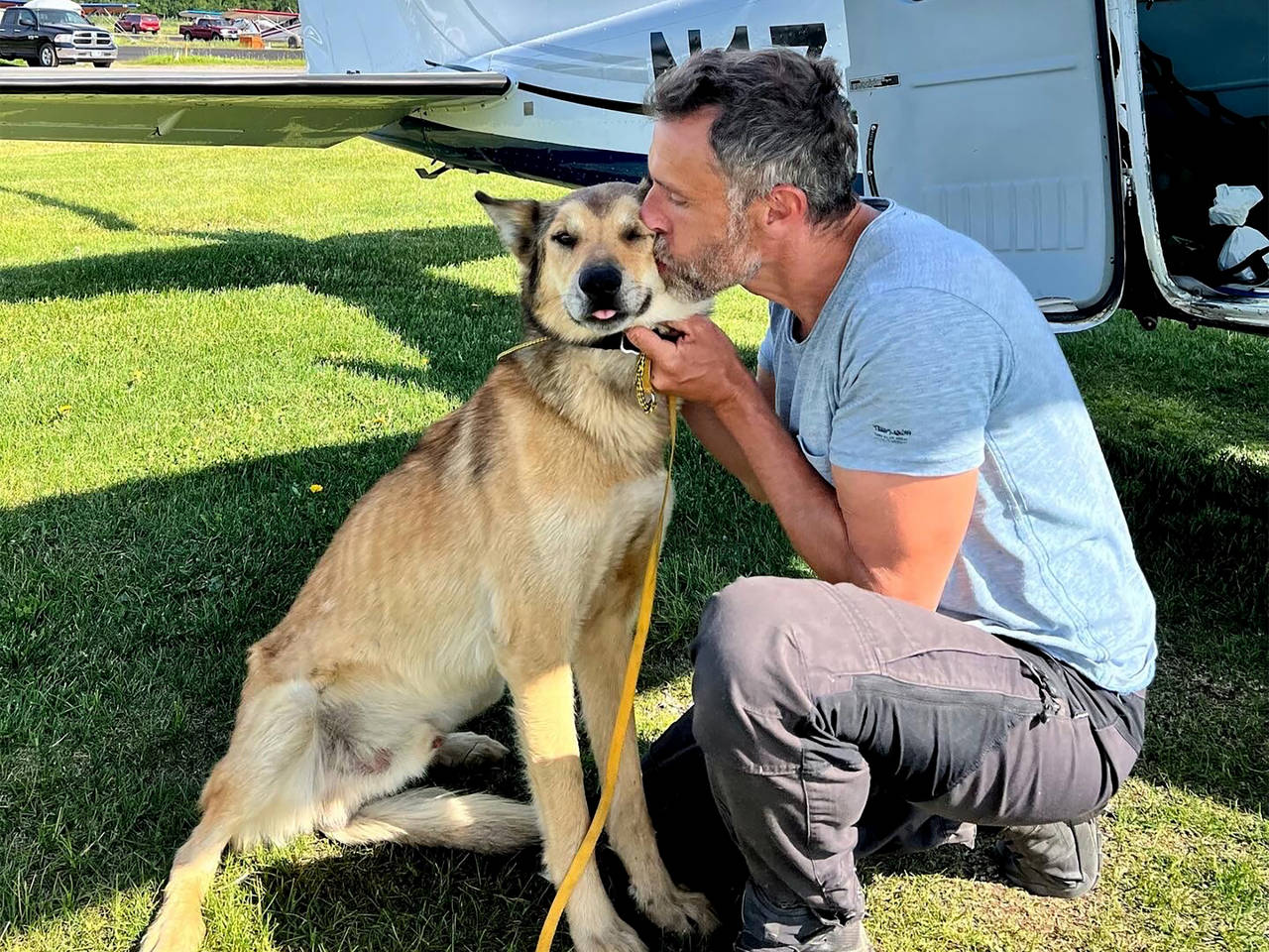In this photo provided by Regal Air, musher Sebastien Dos Santos Borges, of France, and sled dog Le...