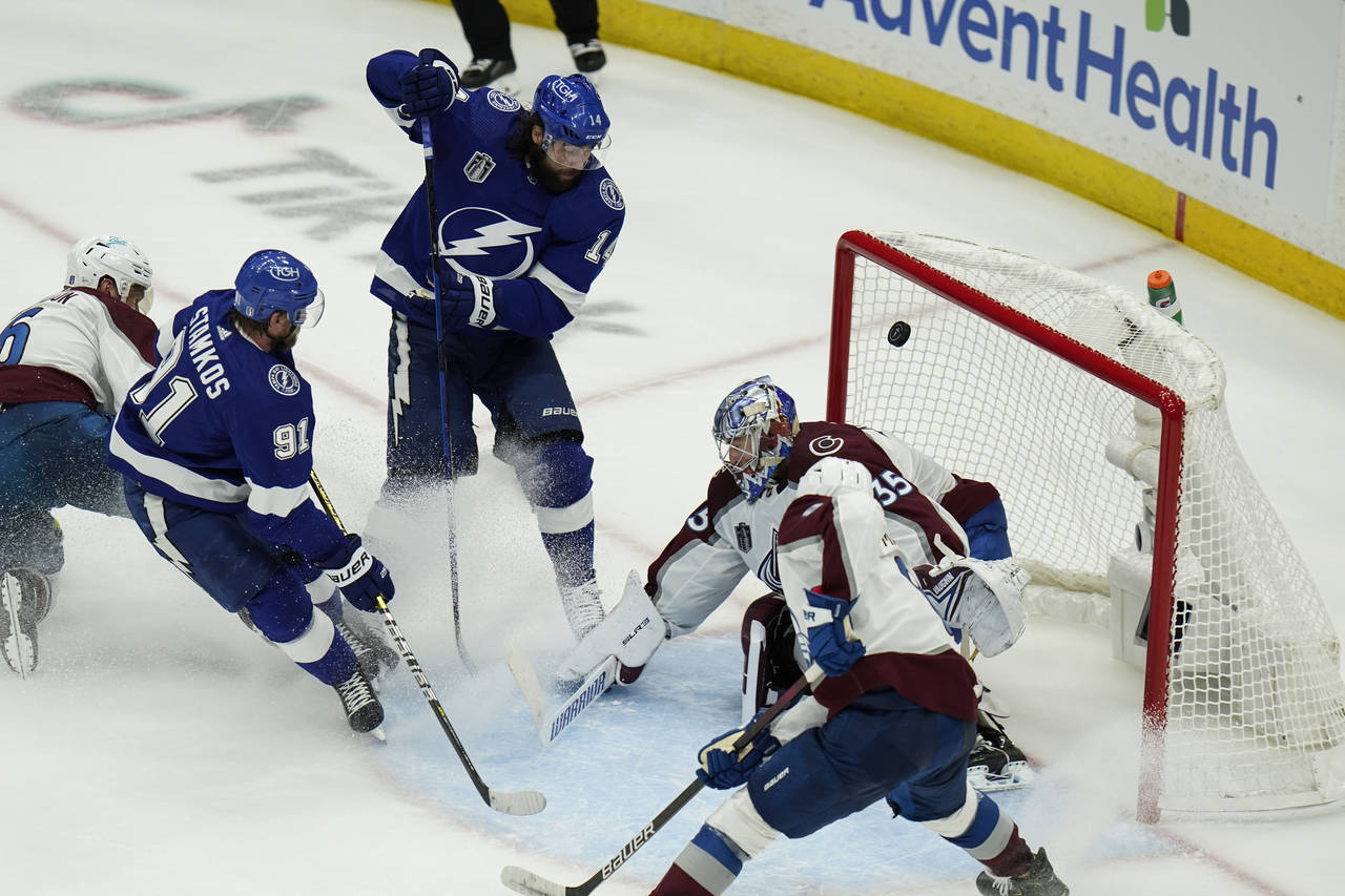Tampa Bay Lightning left wing Pat Maroon (14) scores past Colorado Avalanche goaltender Darcy Kuemp...