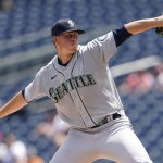 
              Seattle Mariners starting pitcher Chris Flexen throws to the Seattle Mariners in the first inning of the first game of a baseball doubleheader, Wednesday, July 13, 2022, in Washington. (AP Photo/Patrick Semansky)
            