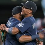
              Seattle Mariners center fielder Julio Rodriguez, right, hugs first baseman Carlos Santana after the team's baseball game against the Toronto Blue Jays, Saturday, July 9, 2022, in Seattle. The Mariners won 2-1 on a two-run home run by Santana during the seventh inning. (AP Photo/Ted S. Warren)
            