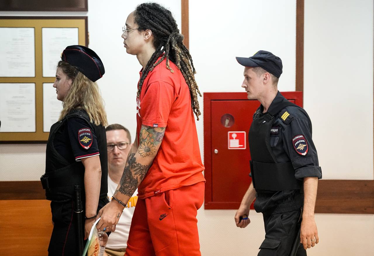 WNBA star and two-time Olympic gold medalist Brittney Griner is escorted to a courtroom for a heari...
