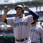 
              Seattle Mariners' Eugenio Suarez reacts after hitting a three-run home run in the first inning of the first game of a baseball doubleheader against the Washington Nationals, Wednesday, July 13, 2022, in Washington. (AP Photo/Patrick Semansky)
            