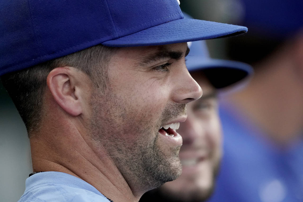 Kansas City Royals' Whit Merrifield watches from the dugout during the second inning of the second ...