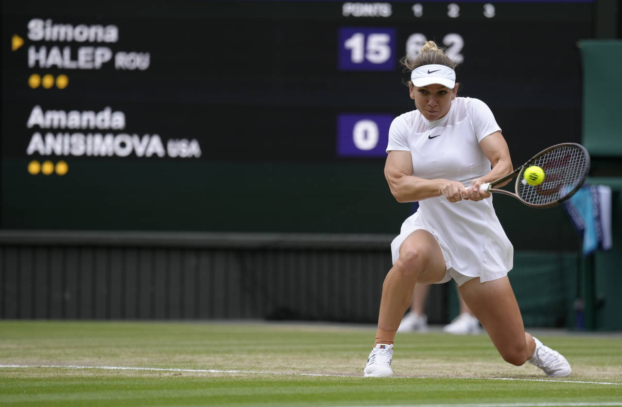 Romania's Simona Halep returns to Amanda Anisimova of the US in a women's singles quarterfinal matc...