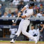 
              New York Yankees' Matt Carpenter hits a three-run home run against the Boston Red Sox during the first inning of a baseball game Saturday, July 16, 2022, in New York. (AP Photo/Frank Franklin II)
            