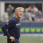 
              Seattle Seahawks head coach Pete Carroll looks toward the scoreboard during the first half of a preseason NFL football game against the Chicago Bears, Thursday, Aug. 18, 2022, in Seattle. (AP Photo/Stephen Brashear)
            