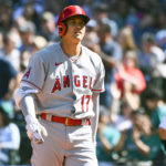 
              Los Angeles Angels designated hitter Shohei Ohtani reacts after being struck out during the seventh inning of a baseball game against the Seattle Mariners, Saturday, Aug. 6, 2022, in Seattle. (AP Photo/Caean Couto)
            