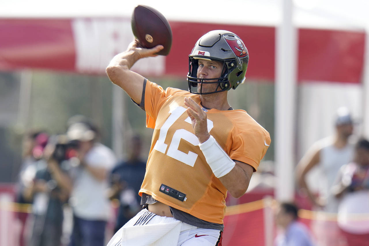 Tampa Bay Buccaneers quarterback Tom Brady throw during an NFL football training camp practice Wedn...