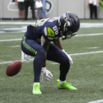 
              Seattle Seahawks' Cade Johnson fumbles on a punt return against the Chicago Bears during the first half of a preseason NFL football game, Thursday, Aug. 18, 2022, in Seattle. The ball was recovered by the Bears' Elijah Hicks for a touchdown. (AP Photo/Stephen Brashear)
            