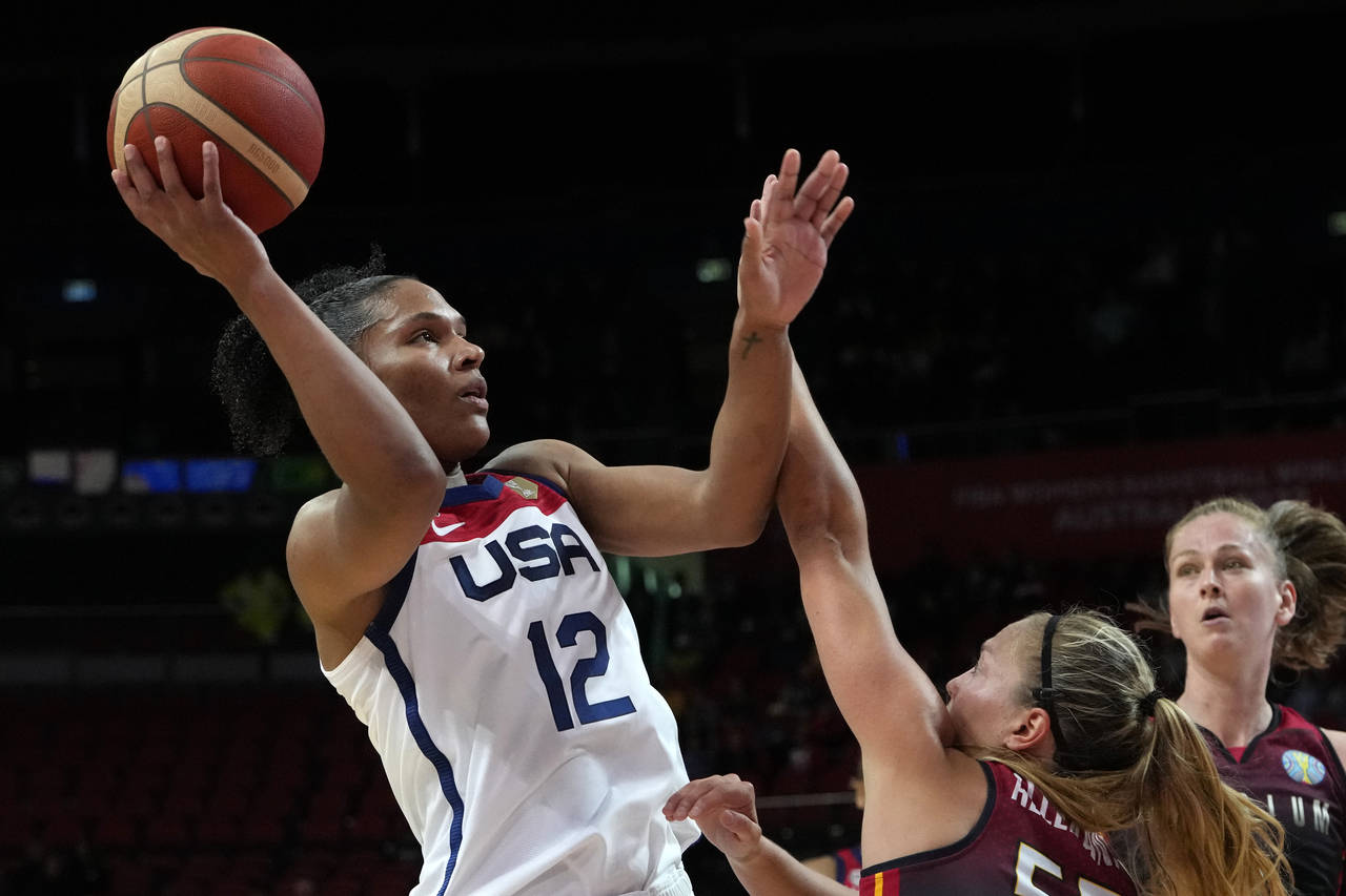 United States' Alyssa Thomas, left, shoots over Belgium's Julie Allemand during their women's Baske...