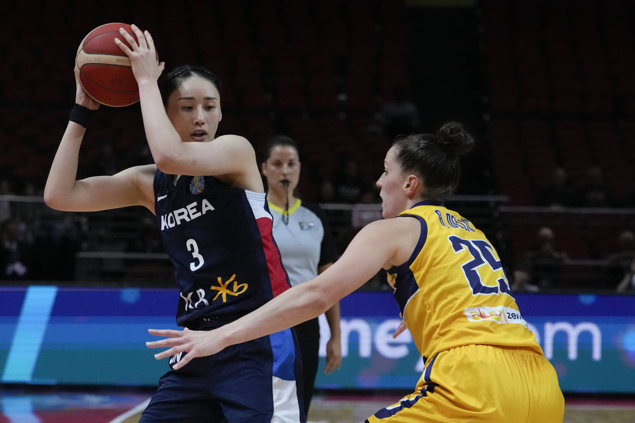 South Korea's Kang Leeseul looks to pass the ball past Bosnia and Herzegovina's Andela Delic during...