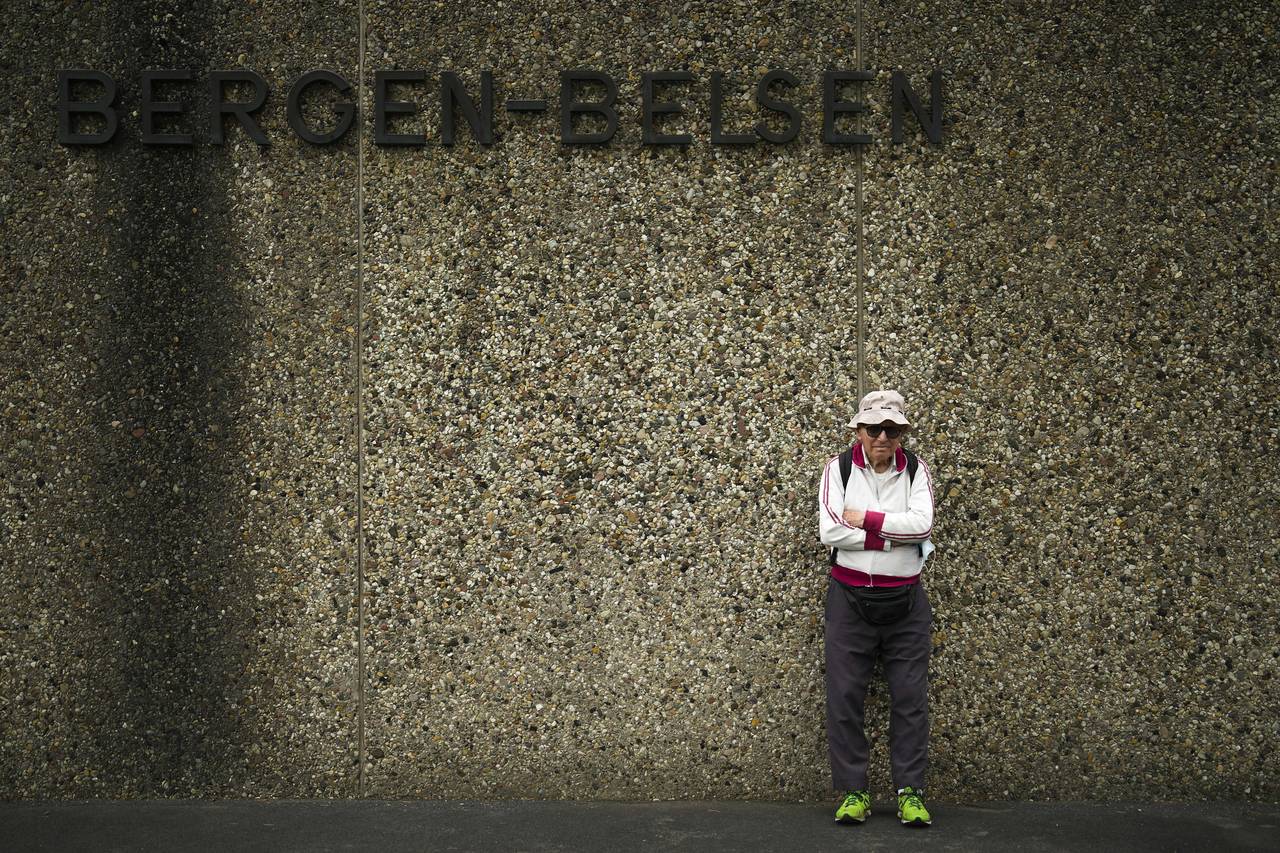 Israeli Olympic race walker Shaul Ladany poses for a photo at the entrance of the Nazi concentratio...