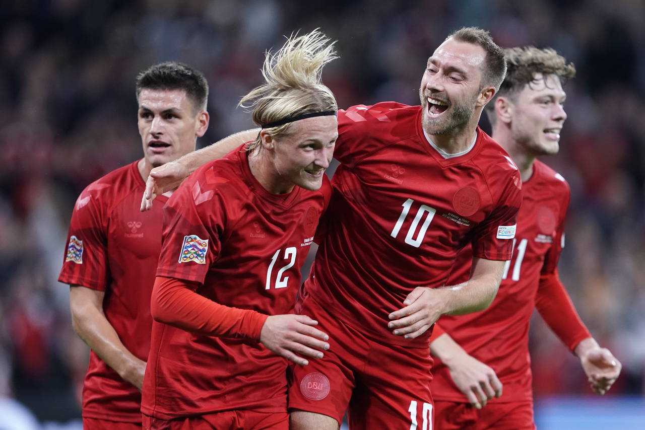 Denmark's Kasper Dolberg, second left, celebrates scoring with teammates Christian Eriksen, center ...