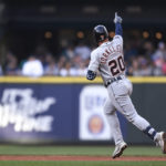 
              Detroit Tigers' Spencer Torkelson gestures as he runs the bases after hitting a two-run home run during the fourth inning of the first game of the team's baseball doubleheader against the Seattle Mariners, Tuesday, Oct. 4, 2022, in Seattle. (AP Photo/Caean Couto)
            