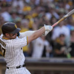 
              San Diego Padres' Brandon Drury watches his two-run single during the fifth inning in Game 2 of the baseball NL Championship Series between the San Diego Padres and the Philadelphia Phillies on Wednesday, Oct. 19, 2022, in San Diego. (AP Photo/Brynn Anderson)
            