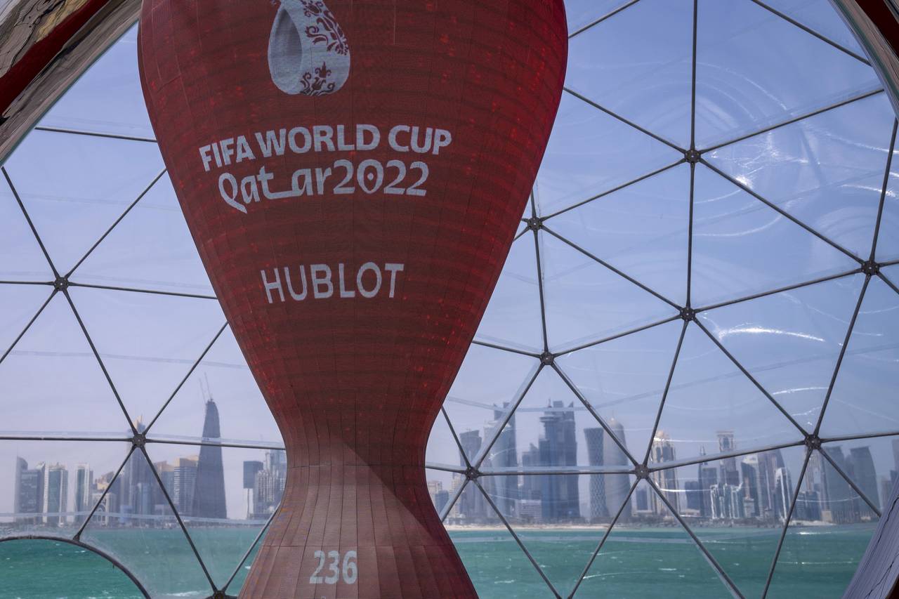 FILE - A count down clock is displayed at the seafront in Doha, Qatar, Tuesday, March 29, 2022. Qat...
