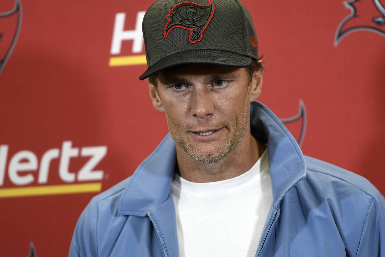 Tampa Bay Buccaneers quarterback Tom Brady meets with reporters after an NFL football game against ...
