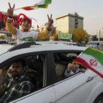 Iran government supporters confront protesters at World Cup
