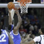 
              Kentucky forward Oscar Tshiebwe (34) grabs a rebound next to Gonzaga center Efton Reid III (15) during the first half of an NCAA college basketball game, Sunday, Nov. 20, 2022, in Spokane, Wash. (AP Photo/Young Kwak)
            