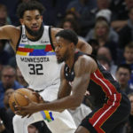 Towns scores 25, Wolves hold on against Heat for 105-101 win