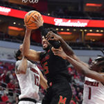 Scott scores 18, No. 22 Maryland blows out Louisville 79-54