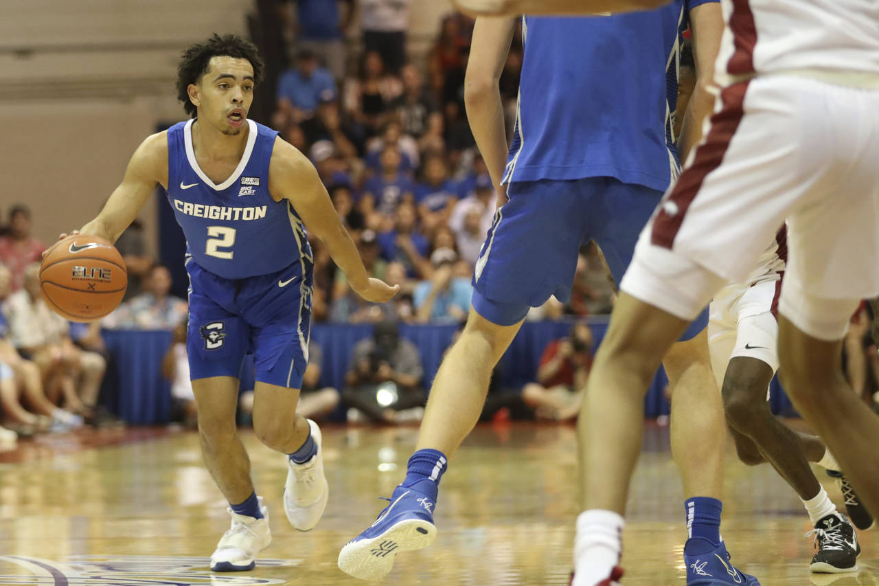 Creighton guard Ryan Nembhard (2) looks for a way through the Arkansas defense during the first hal...