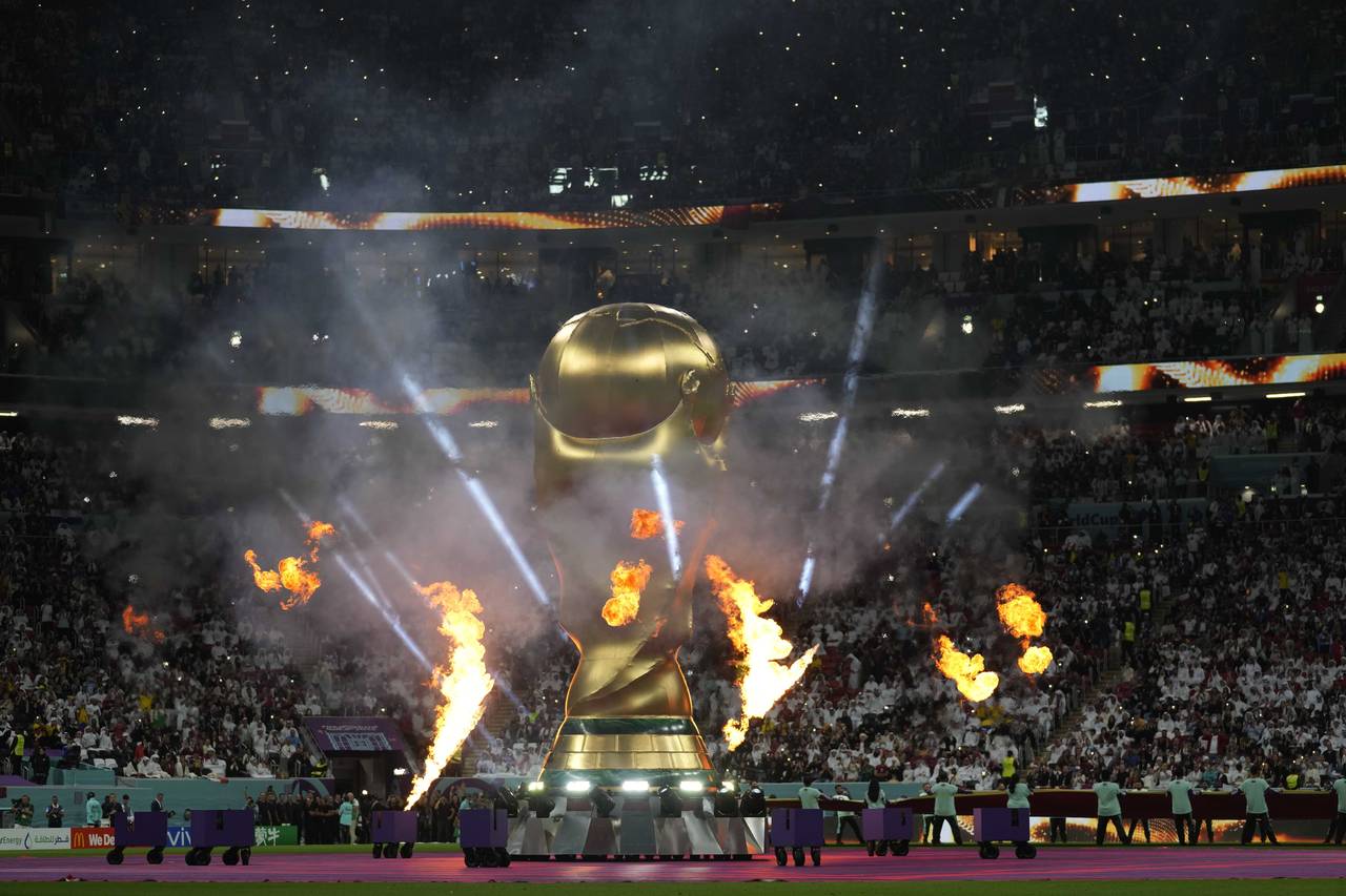 A giant inflateble copy of the trophy is displayed prior to the start of the World Cup group A socc...