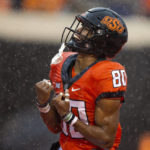 Anderson's 2 long TD runs help W. Virginia top Oklahoma St.