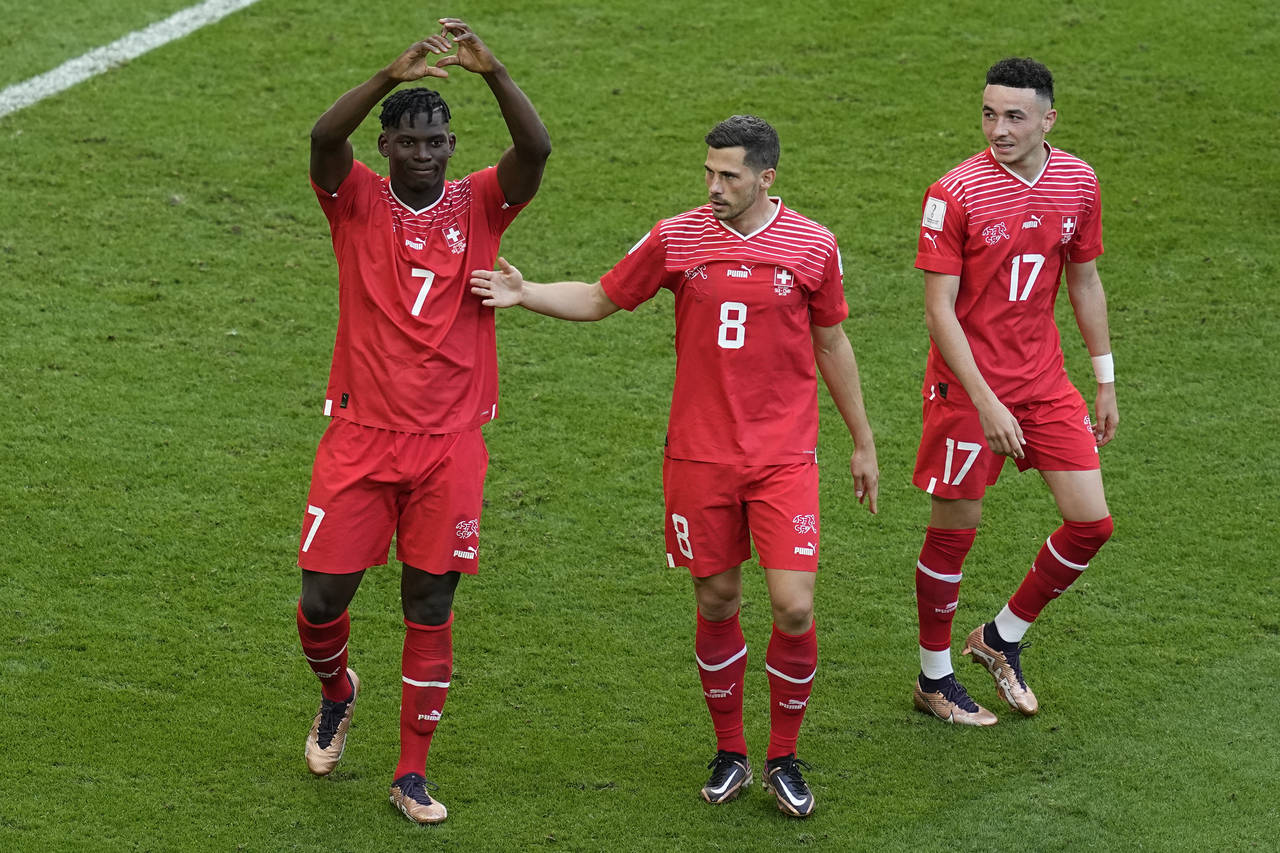 Switzerland's Breel Embolo, left, celebrates after scoring his side's opening goal during the World...