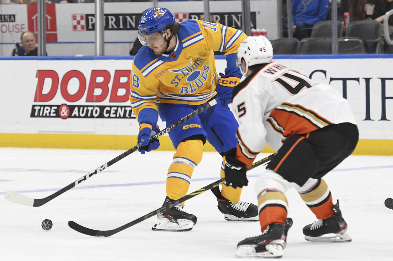 St. Louis Blues' Robert Thomas (18) works the puck against Anaheim Ducks' Colton White (45) during ...