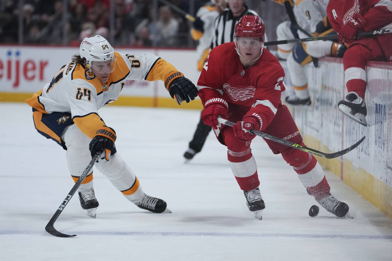 Detroit Red Wings defenseman Olli Maatta (2) passes as Nashville Predators center Mikael Granlund (...