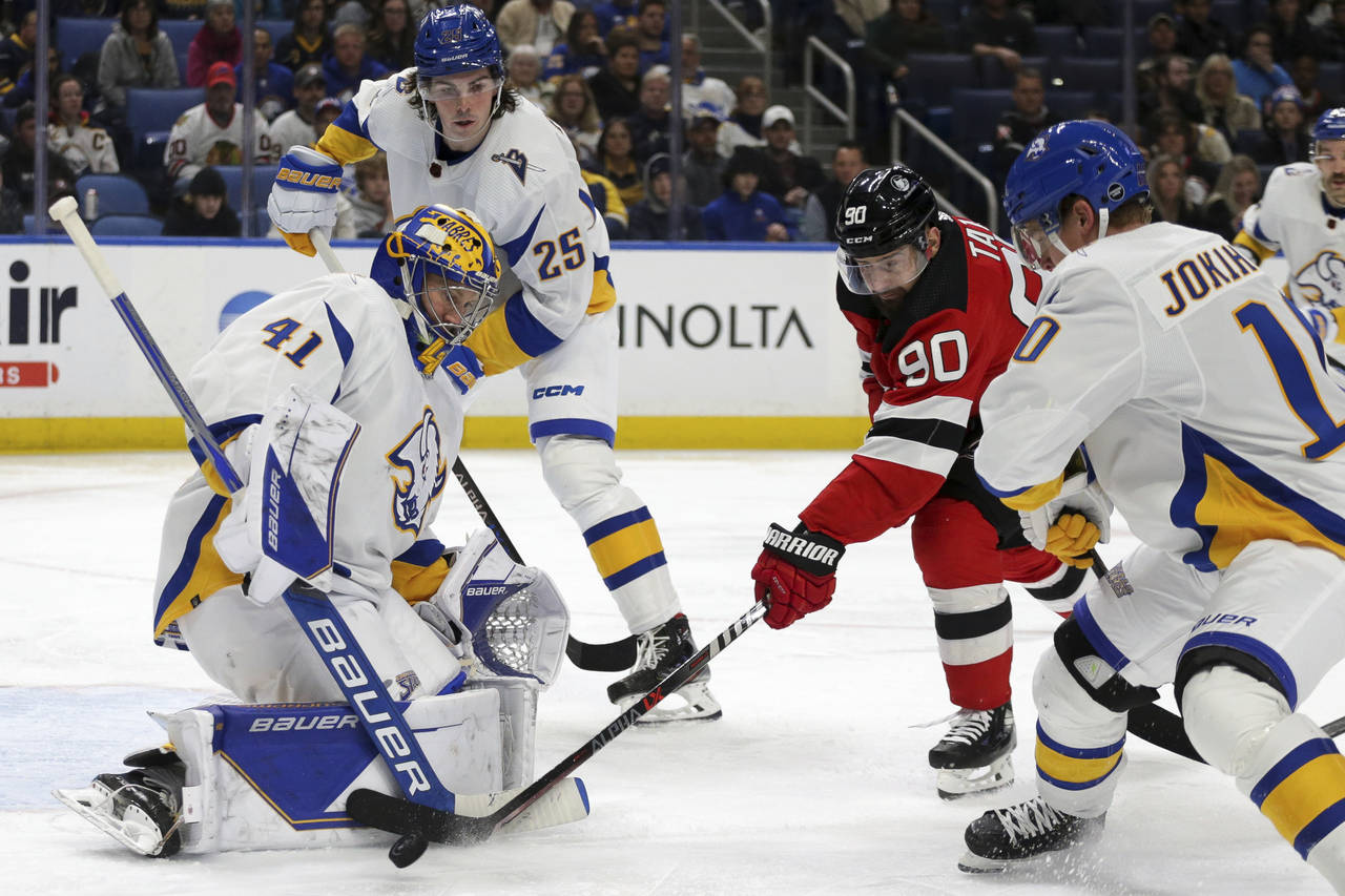 Buffalo Sabres goaltender Craig Anderson (41) blocks a shot by New Jersey Devils left wing Tomas Ta...