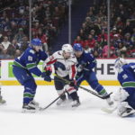 Ovechkin tops Gretzky for most road goals, Caps beat Canucks