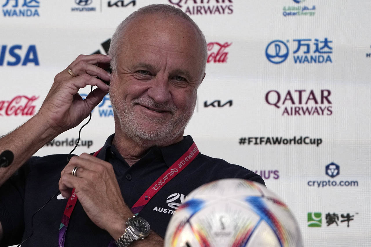 Australia's head coach Graham Arnold adjusts his headphone during a press conference on the eve of ...