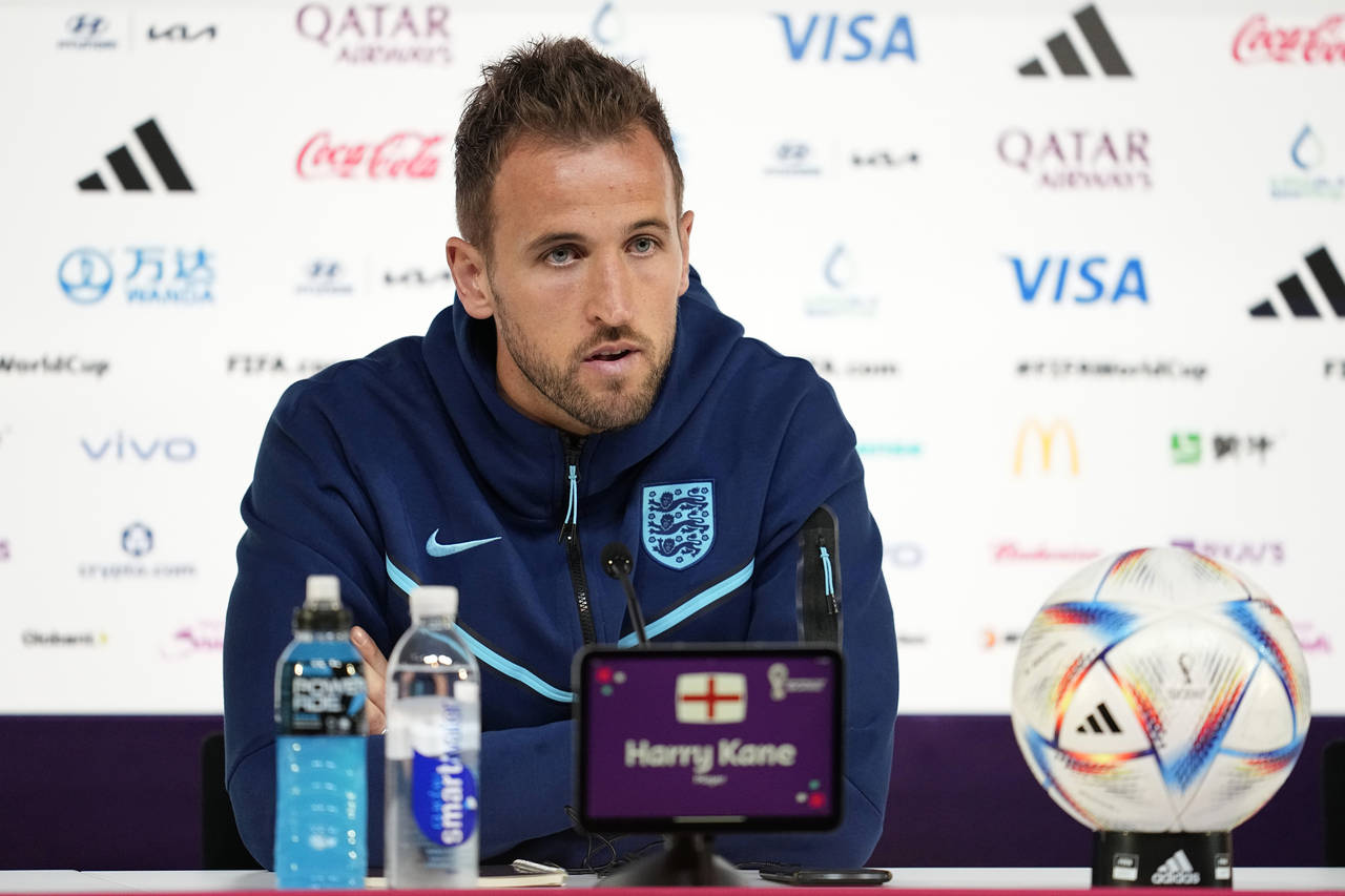 England forward Harry Kane speaks to the media during a press conference at the Qatar National Conv...