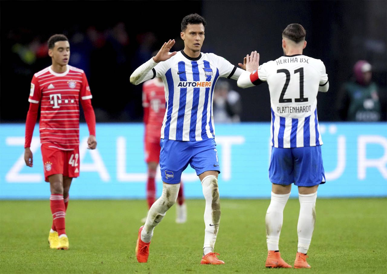 Berlin's Davie Selke, center, celebrates after scoring his side's 2nd goal during the German Bundes...
