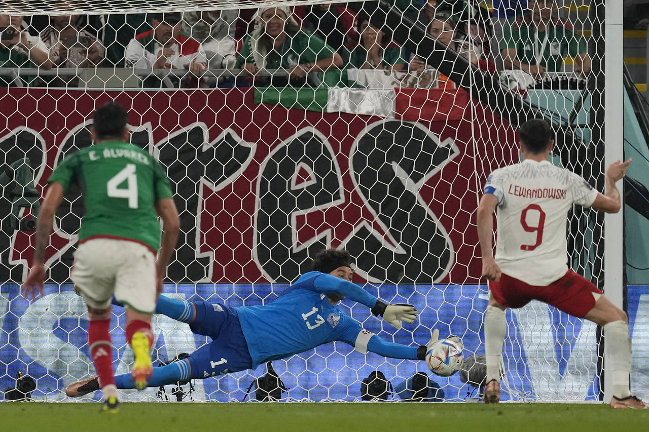 Mexico's goalkeeper Guillermo Ochoa saves a penalty kick by Poland's Robert Lewandowski during the ...